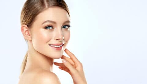 Beautiful Young Woman With Clean Fresh Skin . Facial Treatment . Cosmetology , Beauty And Spa .